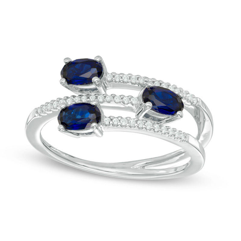 Image of ID 1 Oval Blue Sapphire and 010 CT TW Natural Diamond Three Stone Wrap Ring in Solid 10K White Gold