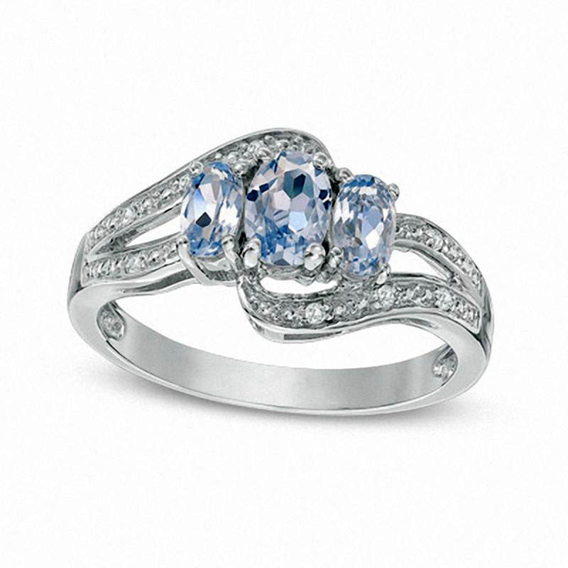 Image of ID 1 Oval Simulated Aquamarine and Lab-Created White Sapphire Three Stone Bypass Ring in Sterling Silver